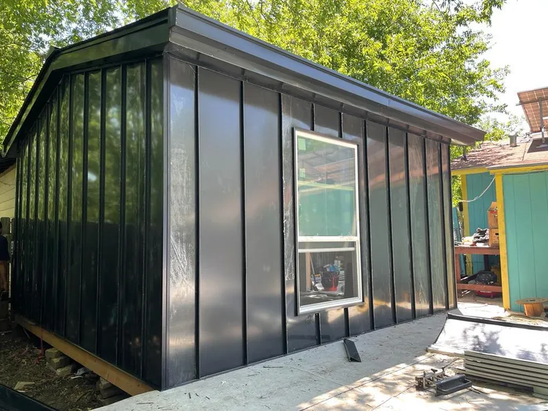 Black standing seam metal wall panels for Roof Inspection in Center Line